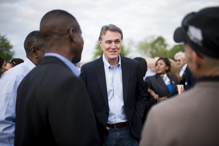 Candidate for U.S. Senate David Perdue speaks with attendees at a Law Enforcement Cookout in Glennville, Ga., on Thursday, April 17, 2014.
