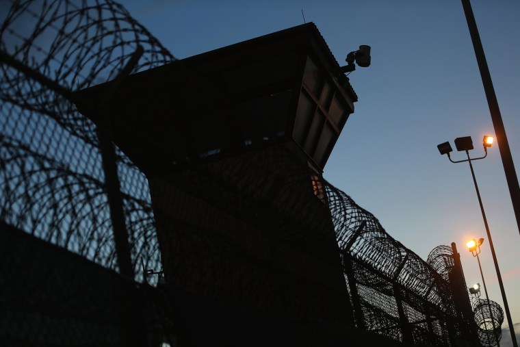 Razor wire is seen near the guard tower at the entrance to Camp V and VI at the U.S. military prison for 'enemy combatants' on June 26, 2013 in Guantanamo Bay, Cuba. (Photo by Joe Raedle/Getty)