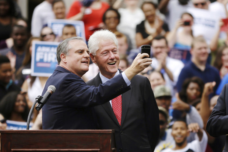 U.S. Sen. Mark Pryor, D-Ark., left, takes a selfie with former President Bill Clinton during a rally for Democrats at the University of Central Arkansas in Conway, Ark., Oct. 6, 2014.