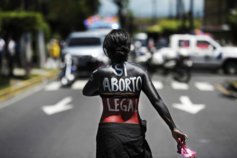 A woman participates in a march on the International Day of Action for the Decriminalization of Abortion, on September 28, 2012 in San Salvador.