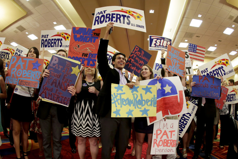 Supporters cheer for U.S. Sen. Pat Roberts at a Johnson County Republican's election watch party, Aug. 5, 2014, in Overland Park, Kan. (Photo by Charlie Riedel/AP)