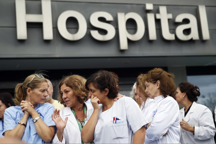 Health workers attend a protest outside La Paz Hospital calling for Spain's Health Minister Ana Mato to resign after a Spanish nurse contracted Ebola, in Madrid, October 7, 2014.
