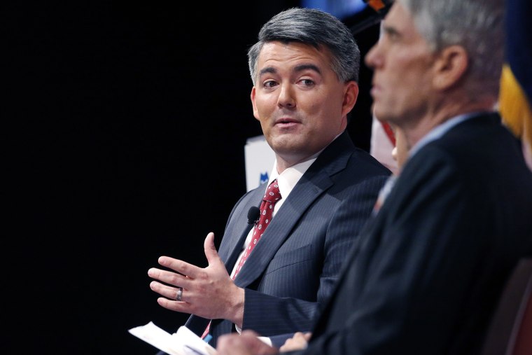 Senatorial candidate U.S. Rep. Cory Gardner, (R-Colo.), left, gestures during a debate with incumbent U.S. Sen. Mark Udall, (D-Colo.), in Denver on Oct. 6, 2014. (Brennan Linsley/AP)