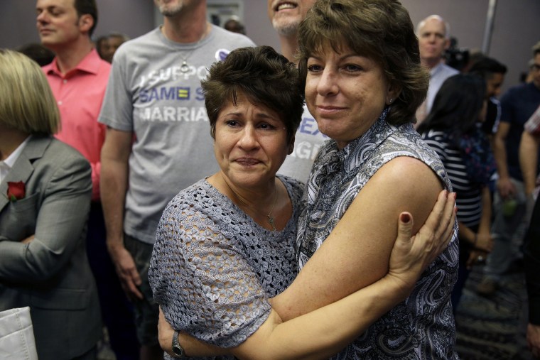 Mercy Leonard, left, embraces Gwen Leonard after an appeals court ruling that overturned Nevada's gay marriage ban on Oct. 7, 2014, in Las Vegas.