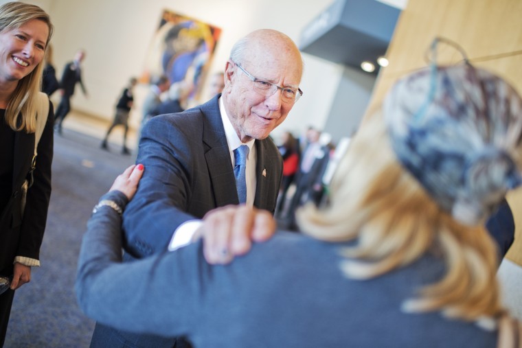 Sen. Pat Roberts, R-Kan., greets guests before a debate with Greg Orman, at the convention center in Overland Park, Kan., October 8, 2014.