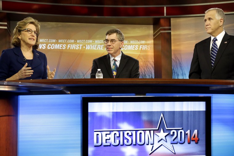 Sen. Kay Hagan, D-N.C., left, speaks as Libertarian Party Senate candidate Sean Haugh, center, and North Carolina Republican Senate candidate Thom Tillis listen during a live televised debate at WECT studios in Wilmington, N.C. on Thursday, Oct. 9, 2014.