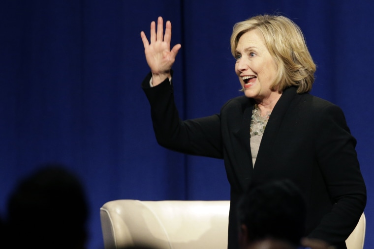 Former U.S. Secretary of State Hillary Rodham Clinton waves as she leaves the Economic Club of Chicago in Chicago on Oct. 8, 2014. (Nam Y. Huh/AP)
