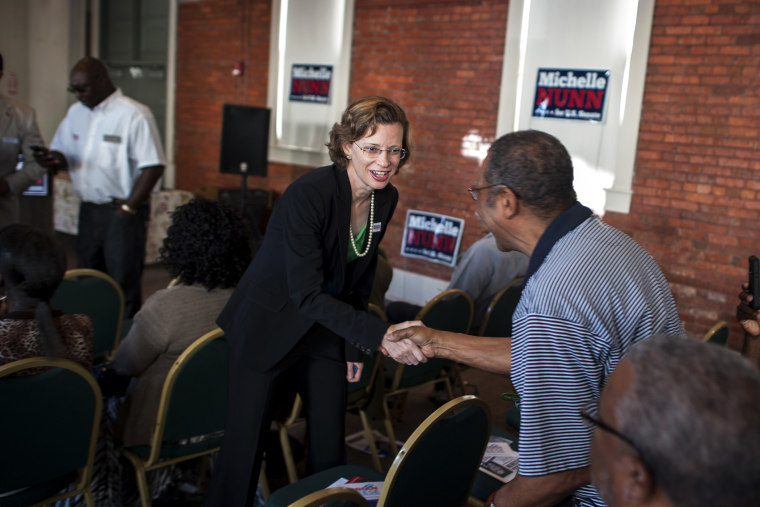 Michelle Nunn, the Democratic candidate for Senate in Georgia, greets supporters at a campaign event in Waycross, Ga., Aug. 13, 2014. (Photo by Stephen Morton/The New York Times/Redux)
