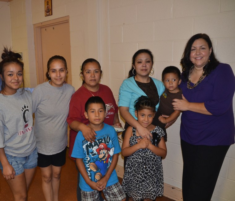 Veronica Isabel Dahlberg (far right), executive director of HOLA Ohio, with Elly Velez Montes (blue shirt) and her family, hours after Montes was released from a four month detention and nearly deported.