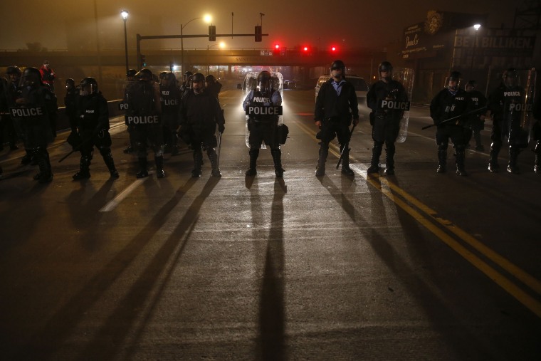 St. Louis Police department officers block the Grand bridge in St. Louis, Mo., early on Oct. 13, 2014.