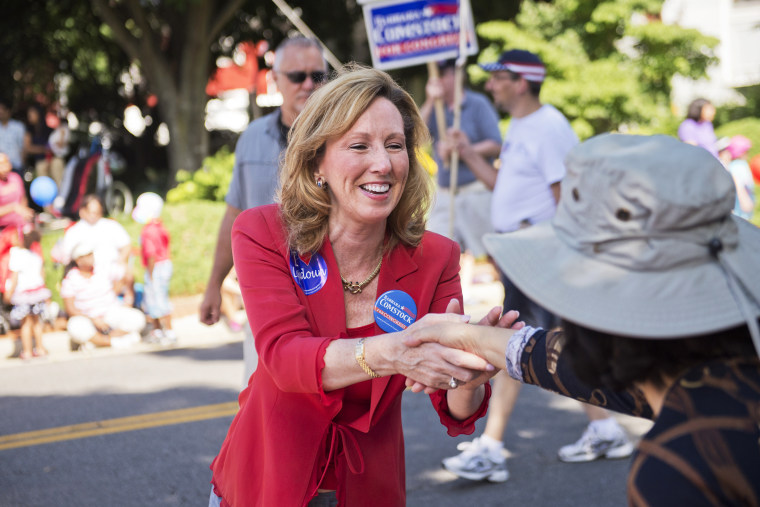Barbara Comstock, Republican candidate for Virginia's 10th Congressional District, greets attendees of Leesburg's Independence Day parade, July 4, 2014, in Leesburg, Va. (Photo By Tom Williams/CQ Roll Call/Getty)
