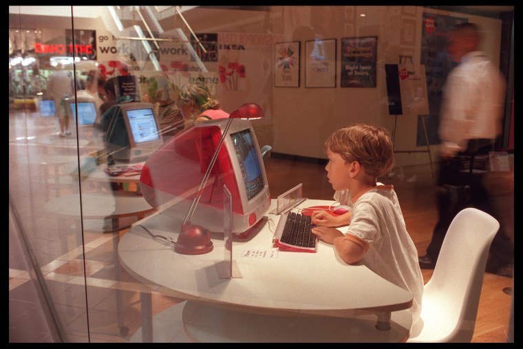 A young boy uses a computer at the Media Shopping center in Burbank, Calif. on Aug. 28, 1999. (Photo by Dan Callister/Hulton/Getty)