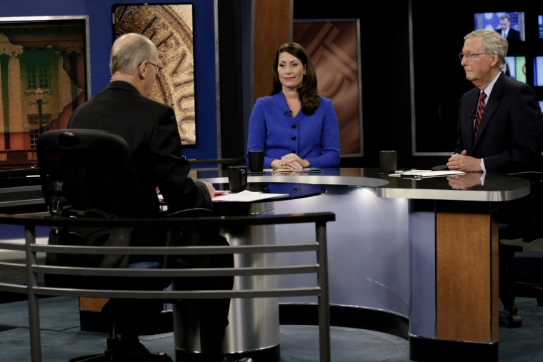 Republican U.S. Senate Minority Leader Mitch McConnell (R) and Democratic U.S. Senate candidate Alison Lundergan Grimes (L) prepare for their debate at the Kentucky Education Television network headquarters in Lexington, Ky on Oct. 13, 2014.