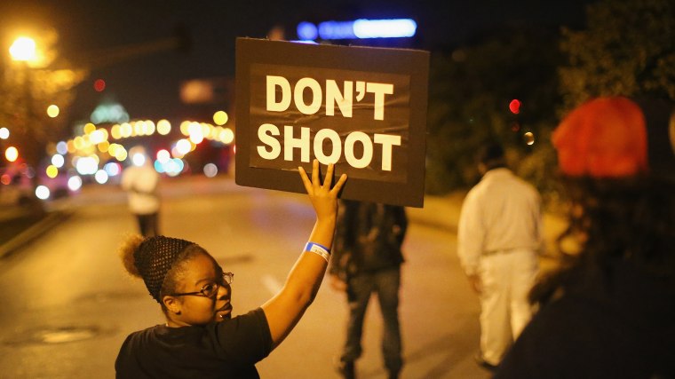 Demonstrators march through the streets protesting the October 8 killing of 18-year-old Vonderrit Myers Jr. by an off duty St. Louis police officer on Oct. 9, 2014 in St Louis, Mo.