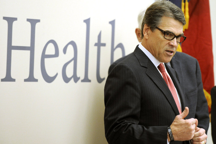 Texas Gov. Rick Perry makes a point as he speaks during a visit to the Galveston National Lab on Oct. 7, 2014, in Galveston, Texas.