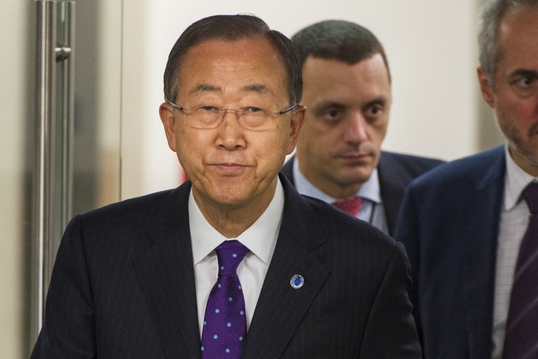 In this photo provided by the United Nations, United Nations Secretary-General Ban Ki-moon arrives for a press briefing wearing a purple tie in recognition of \"Spirit Day\" on Oct. 16, 2014 at the U.N. headquarters.