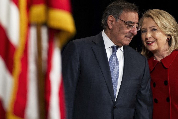 Leon Panetta Hillary Clinton speak prior to Clinton receiving the Department of Defense Medal for Distinguished Public Service during a ceremony at the Pentagon in Washington, DC on Feb. 14, 2013