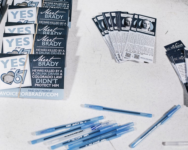 Post cards and book marks sit on a table at the \"A Voice for Brady Benefit Concert\" in Denver, Co.