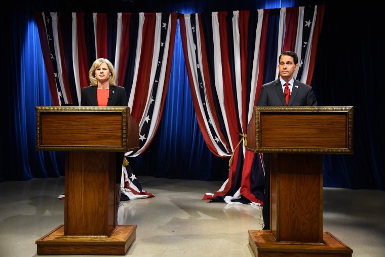 Wisconsin Republican Governor Scott Walker, right, and Democratic challenger Mary Burke, left, prepare for a televised debate on Oct. 17, 2014 in Milwaukee, Wis.