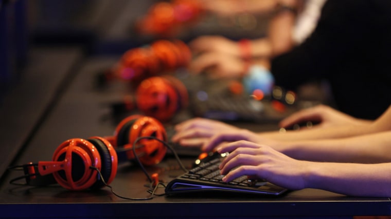 Gamers play video games during the Gamescom 2014 fair in Cologne on Aug. 13, 2014. (Photo by Ina Fassbender/Reuters)