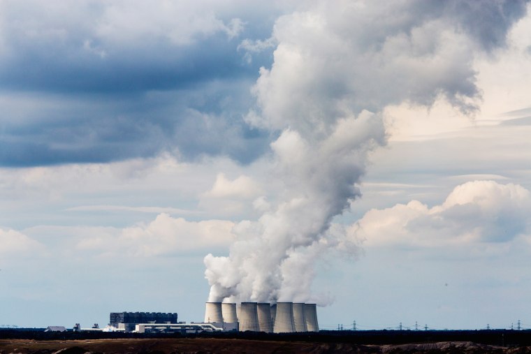 Steam rises from the cooling towers of the Jaenschwalde coal-fired power plant on Aug. 23, 2014 near Gross Gastrose, Germany.