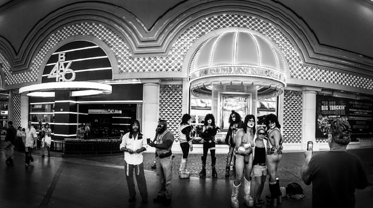 Rick James, Mr. T and Kiss impersonators pose with tourists in front of the Golden Nugget in Las Vegas.