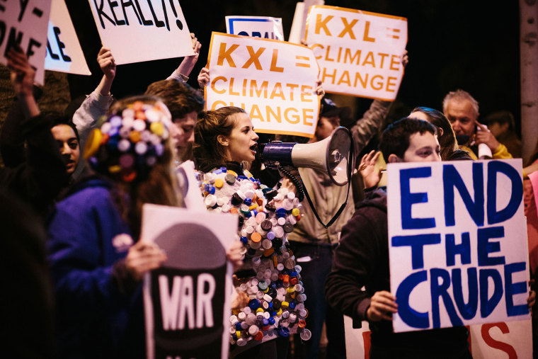 Protestors urge President Obama to reject the Keystone KXL Pipeline in Santa Monica, Calif. on Feb. 3, 2014. (Photo by Laura Kleinhenz/Redux)