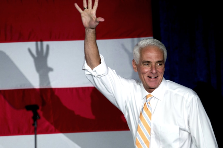 Former Florida Republican Gov. Charlie Crist, now running as a Democrat, waves to supporters during a campaign event, on Oct. 17, 2014, in Miami Gardens, Fla.