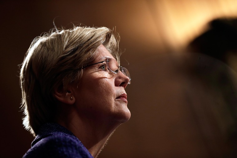 Sen. Elizabeth Warren (D-Mass.) listens during a hearing on Nov. 12, 2013 in Washington, D.C. (Photo by Win McNamee/Getty)