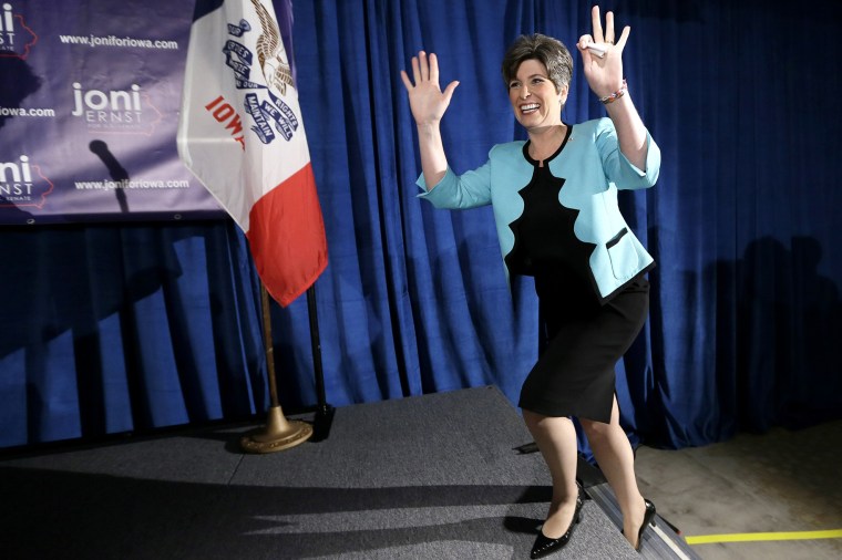 State Sen. Joni Ernst waves to supporters on June 3, 2014, in Des Moines, Iowa. (Photo by Charlie Neibergall/AP)