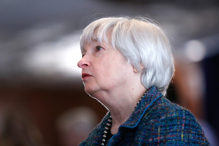 U.S. Federal Reserve Chair Janet Yellen speaks with participants as she arrives to deliver remarks at the Federal Reserve headquarters in Washington on Oct. 30, 2014.