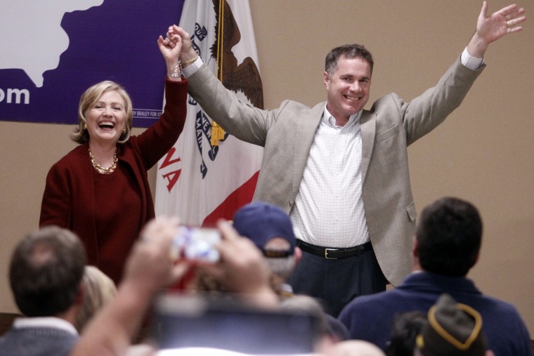 Former Secretary of State Hillary Rodham Clinton speaks and Rep. Bruce Braley, D-Iowa wave to supporters during a campaign even for his senatorial race, Wednesday, Oct. 29, 2014, in Cedar Rapids, Iowa.