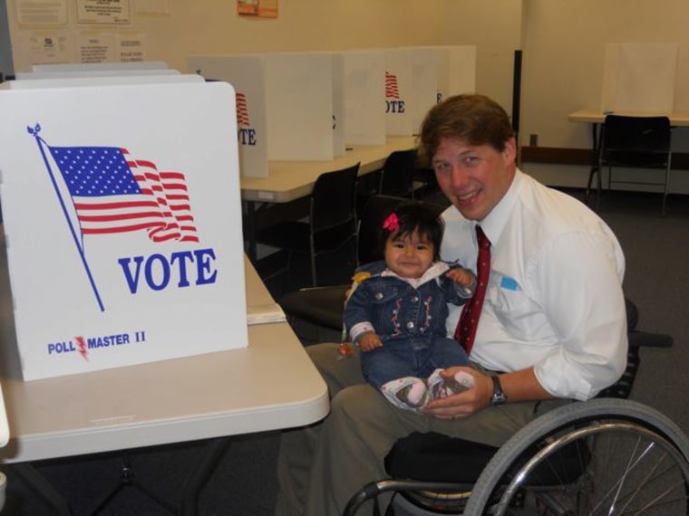 Darryl Fairchild and his daughter Maya voting in Dayton, Ohio in 2011.