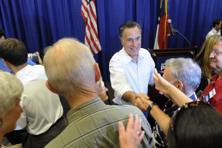 Former Republican presidential candidate Mitt Romney greets an enthusiastic crowd during a campaign event for Republican senate candidate David Perdue on Oct. 29, 2014, in Augusta, Ga. (Michael Holahan/The Augusta Chronicle/AP)