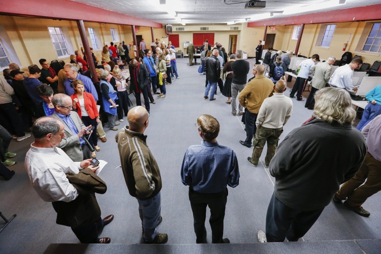 Voters wait in a long line to cast their ballots at Epworth United Methodist Church during the midterm Election Day in Atlanta, Ga. on Nov. 4, 2014.