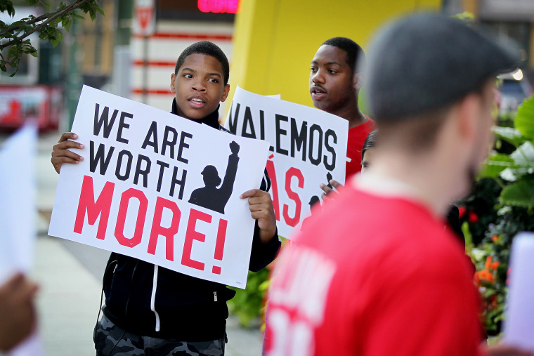 Fast food workers and activists demonstrate outside McDonald's downtown flagship restaurant on July 31, 2014 in Chicago, Ill.