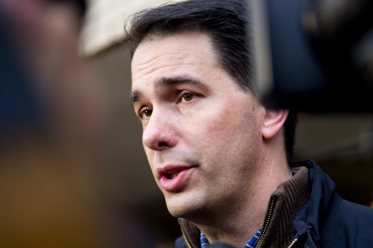 Wisconsin Gov. Scott Walker talks to the media after he casts his ballot on election day at Jefferson Elementary School on Nov. 4, 2014 in Milwaukee, Wis. (Darren Hauck/Getty)