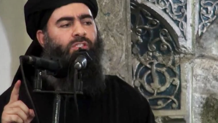 This file image made from video posted on a militant website which has been authenticated based on its contents and other AP reporting, purports to show the leader of the Islamic State group, Abu Bakr al-Baghdadi, delivering a sermon at a mosque in Iraq.