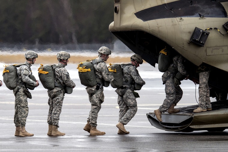 Paratroopers of the US Army enter a helicopter at the training area in Grafenwoehr, Germany on Feb. 10, 2014.