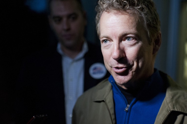 Sen. Rand Paul, R-Ky., speaks to the media after a rally with Senate Minority Leader Mitch McConnell, R-Ky., at the airport in Bowling Green, Ky., Nov. 3, 2014.
