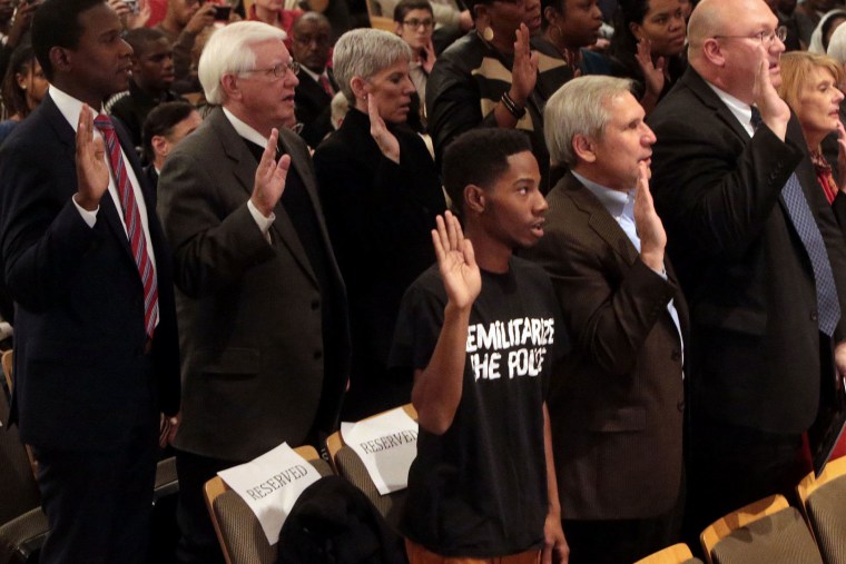Members of the Ferguson Commission are sworn in at the Missouri History Museum on Nov. 18, 2014.