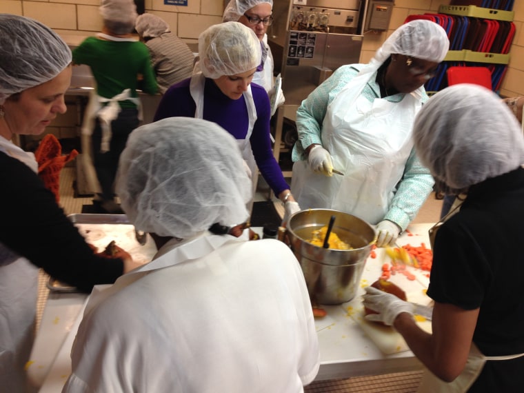 Women attend a SMART University cooking class.