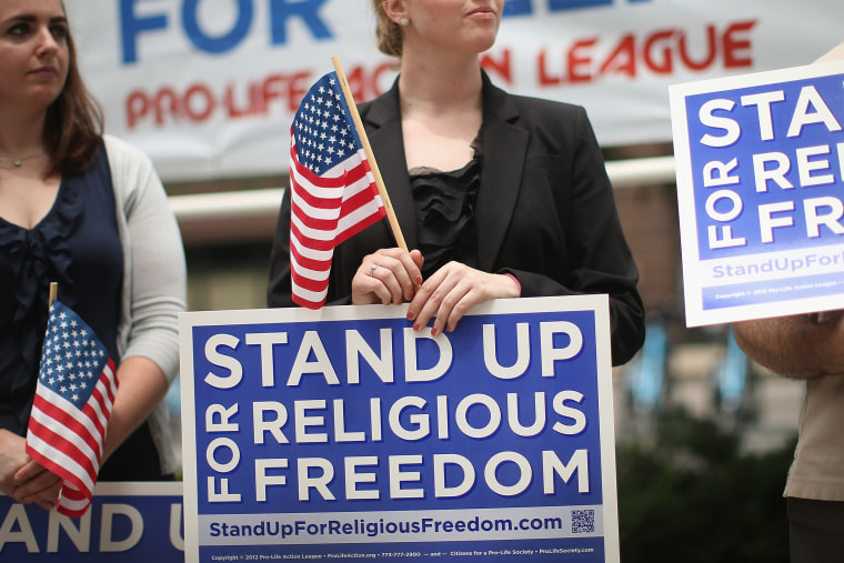 Religious freedom supporters hold a rally to praise the Supreme Court's decision in the Hobby Lobby contraception coverage requirement case on June 30, 2014 in Chicago, Ill. (Scott Olson/Getty)