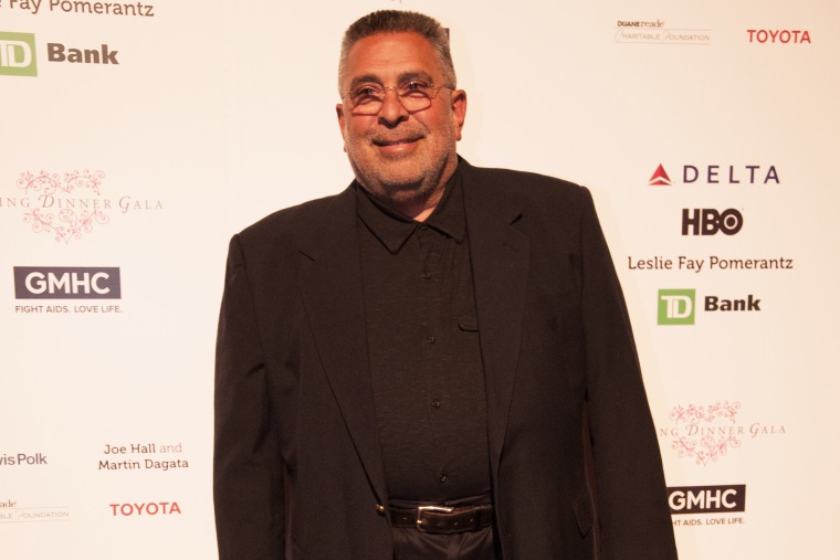 Dr. Larry Mass attends GMHC's annual Savor dinner.