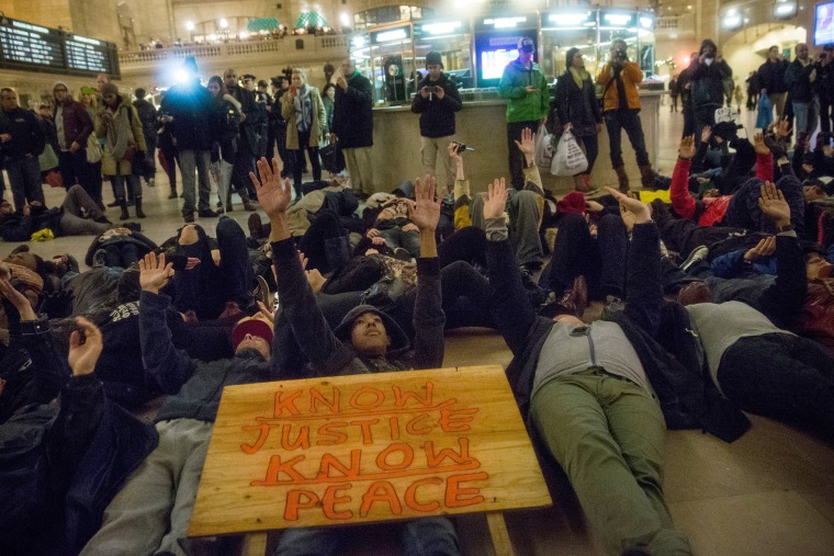 Demonstrators stage a Die-In in Grand Central Terminal protesting the Staten Island, N.Y. grand jury's decision not to indict a police officer involved in the chokehold death of Eric Garner in July on Dec. 6, 2014. (Andrew Burton/Getty)