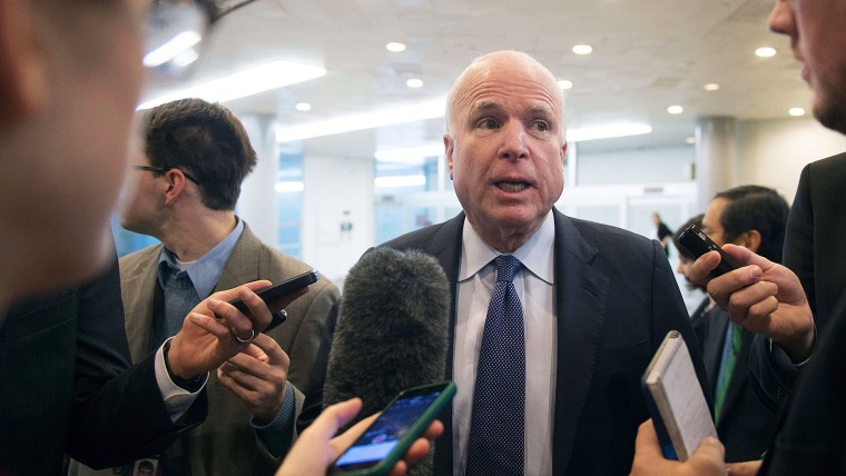 Senator John McCain speaks to reporters about the release of a report on CIA interrogations of high-value terrorists a decade ago in Washington, DC on Dec. 9, 2014. (Jim Watson/AFP/Getty)