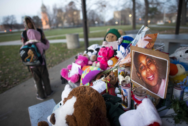 Kiara Jacobs, 8, hugs her brother Quentin Stamen, 13, at a memorial where Tamir Rice was fatally shot by Cleveland police officers who mistook the 12 year old's toy gun for a real gun.