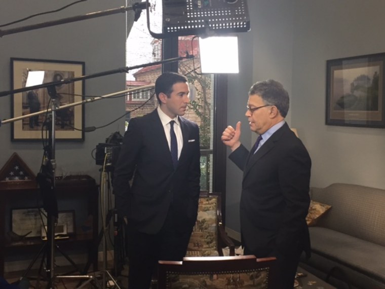 U.S. Sen. Al Franken, D-Minn., talks to Ari Melber during their interview.