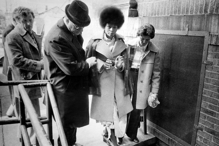 JoAnne Chesimard is taken chained handcuffs and leg irons from Riker's Island prison in New York City to the Middlesex County jail to await trail in the murder of state trooper Werner Foerster. (Photo by Frank Hurley/NY Daily News Archive/Getty)