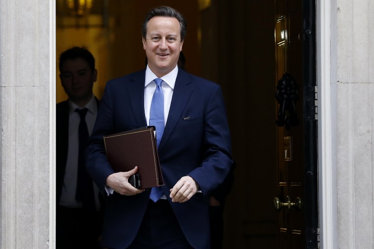 Britain's Prime Minister David Cameron smiles as he leaves 10 Downing Street in London, on Nov. 20, 2014.
